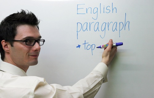 English teacher teaching on the board