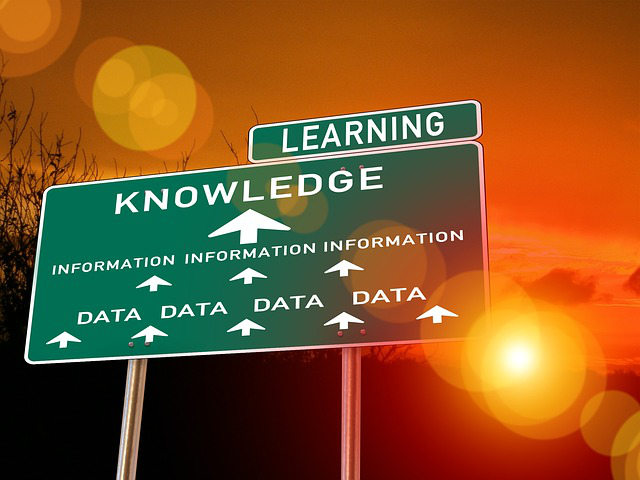 Traffic sign pointing towards learning knowledge data information 