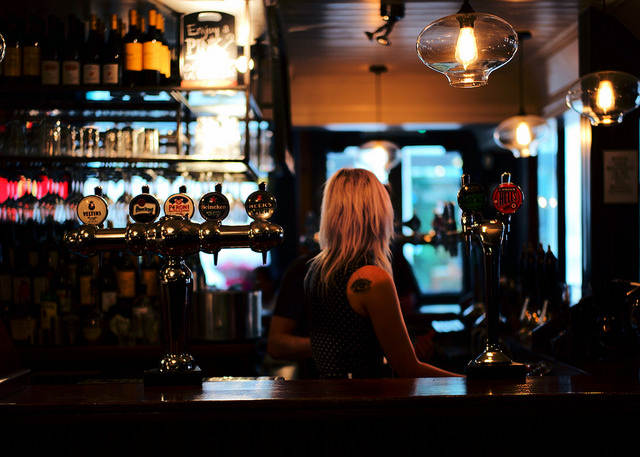 Bartender job beer on tap bar dark pub London Mayfair District