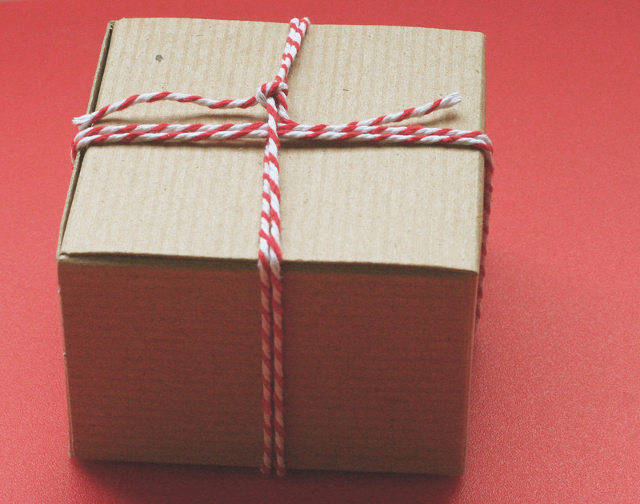 Brown Paper Package tied up with red string 