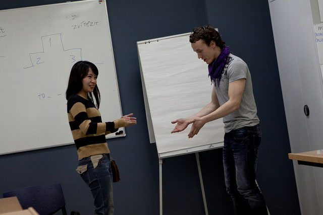 Two people at a language teaching workshop