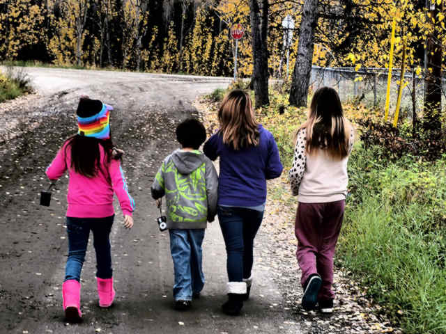 Children walking together colorful clothing 