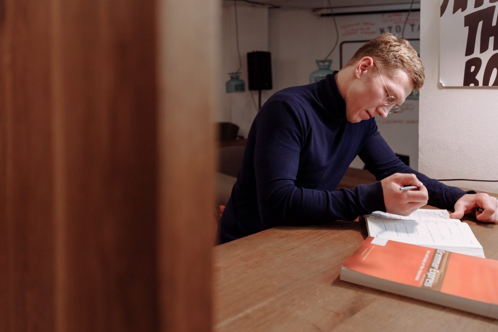 Man writing in notebook