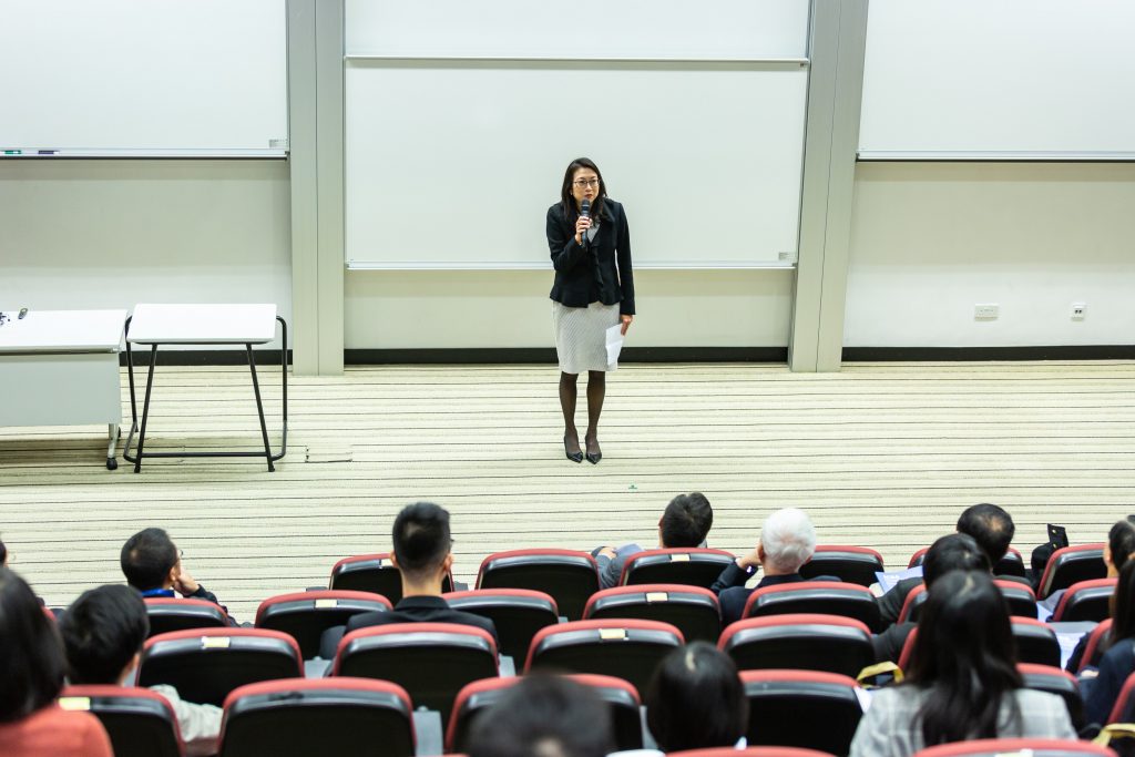 Asian woman giving speech