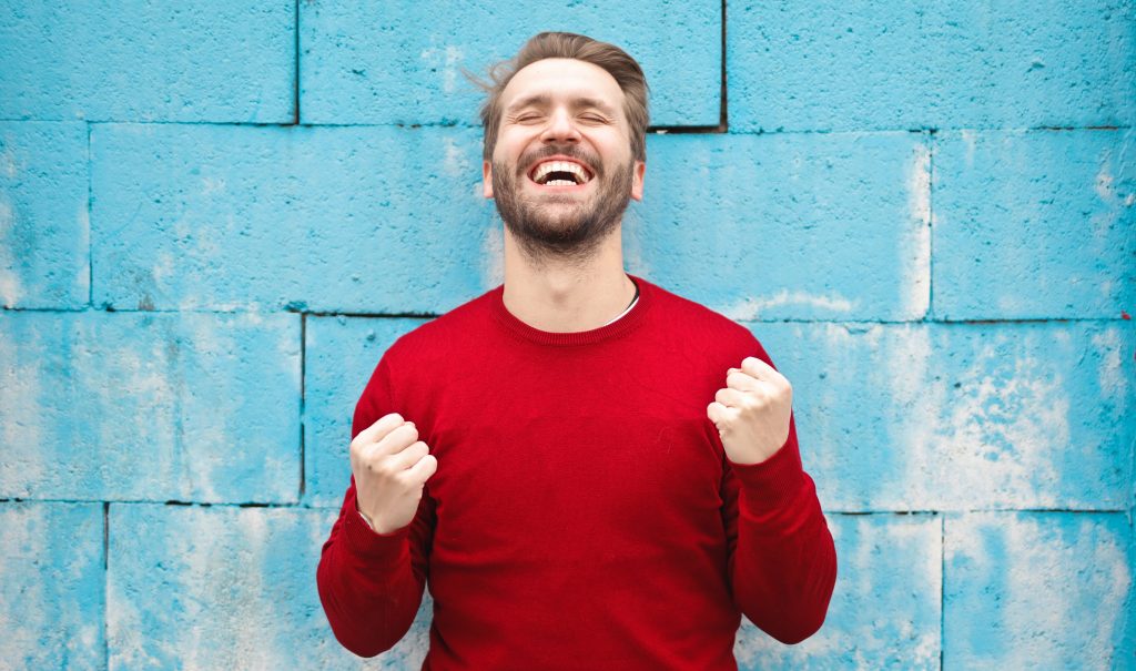 Happy man wearing a red shirt
