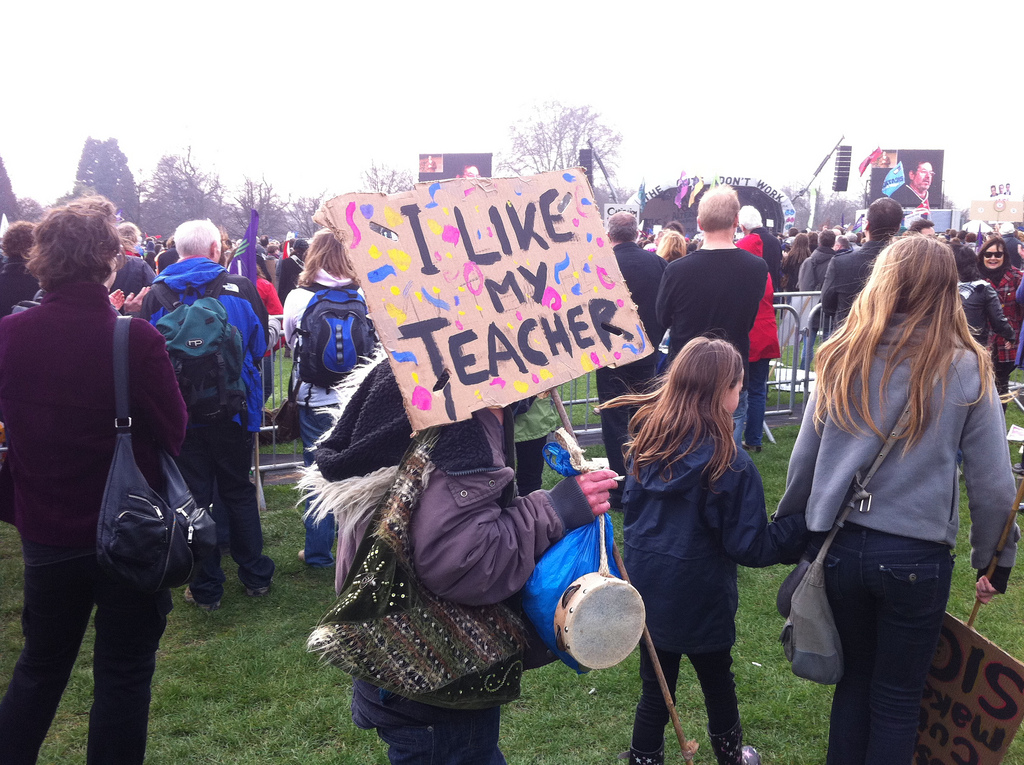 Girl holding I Like My Teacher Sign