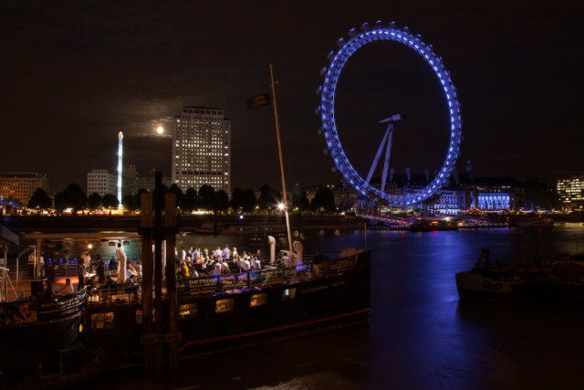 London Eye moonlight on the thames river 