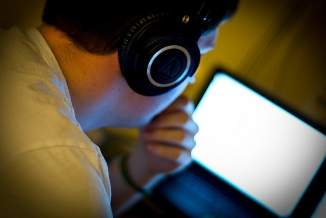 A man listening through headphones