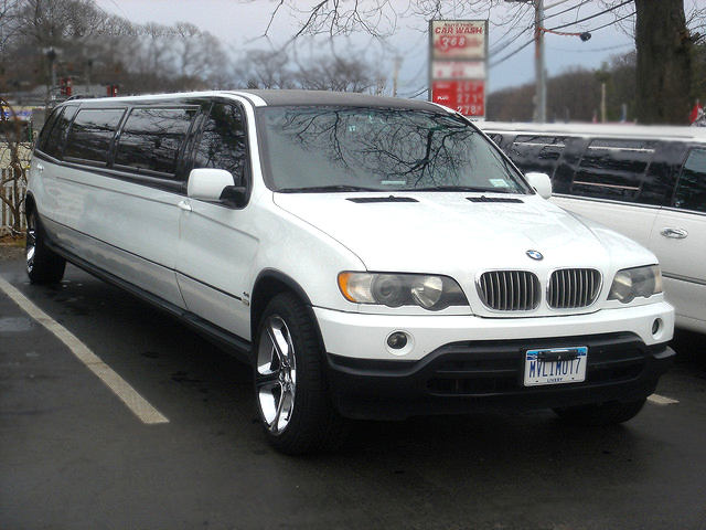 white BMW X5 Stretch Limo parked