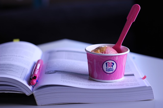 Baskin Robbins Ice Cream over textbook book