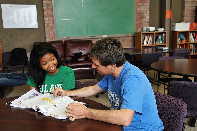 Tutor teaching student