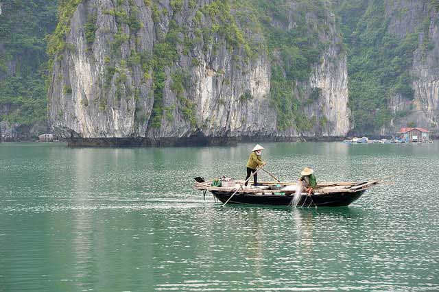 Vietnamese travelers on a boat