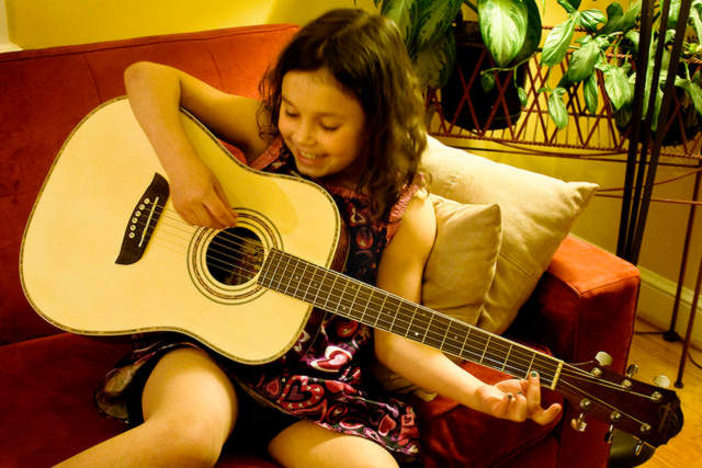 Guitar practice young girl 